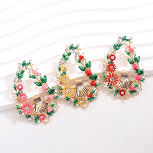 Elegant vintage enamel floral wreath brooch with colorful petals and rhinestones