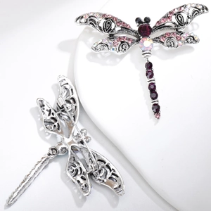 Detailed front and back views of a dragonfly brooch with purple rhinestones and silver alloy