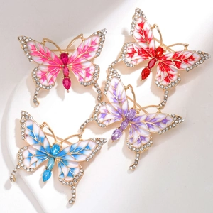 Set di quattro spille a farfalla colorate con smalto, perle e cristalli su supporto