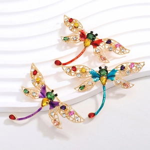 Elegante libelle-broches met gekleurde emaille vleugels en fonkelende stras