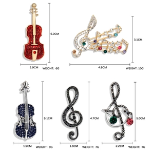 Set of musical instrument brooches with violin and notes in rhinestone and enamel