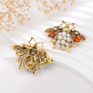 Vintage gold bee brooch with pearls and amber rhinestones shown from front and back views