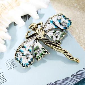 Vue détaillée de la broche papillon vintage en émail bleu et strass sur alliage doré
