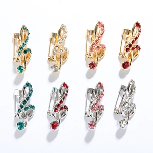 Lot de 8 broches notes de musique en or et argent avec des strass colorés brillants