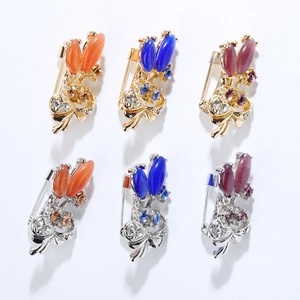 Set of vintage tulip flower brooches with cat eye stones and rhinestones in various colors