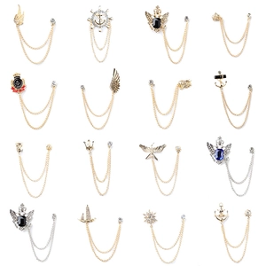 Collection of vintage gold and silver brooches with chains in various classic designs