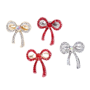 Set of four butterfly bow crystal brooches in red and silver sparkling rhinestones