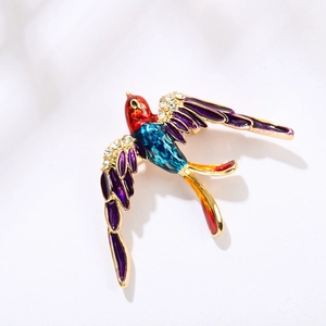 Broche colibri exquise avec ailes en émail coloré et strass étincelants incrustés