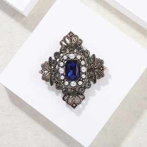 Vintage European style sapphire brooch with pearls and emerald-cut blue crystal on gold base