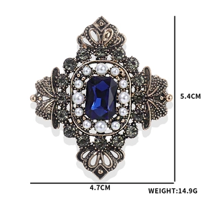 Vintage royal sapphire brooch with pearls and crystals in antique gold finish