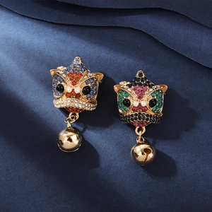 Detailed close-up of Chinese lion dance earrings with colorful rhinestones and gold bells