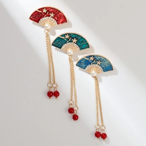 Detailed macro of Chinese-style fan-shaped brooches with elegant hanging tassels and pearls