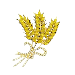 Elegante gouden tarwebroche met gele marquise edelstenen en glinsterende strassteentjes