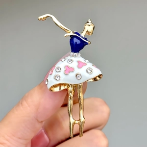 Detail of elegant ballerina brooch with blue enamel and crystal-studded polka dot tutu