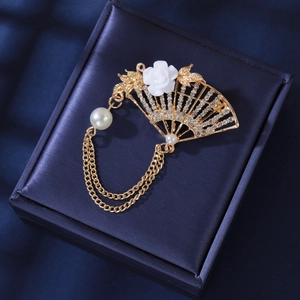 Vintage gold fan brooch with rose motif, sparkling crystals, and pearl tassel pendant