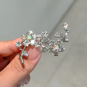 Elegant silver flower brooch with sparkling rhinestones and iridescent gems for women