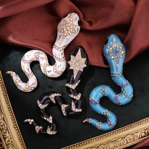 Retro snake brooch set with crystal rhinestones in white, black and blue colors