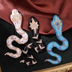 Vintage zodiac snake brooches with rhinestones and enamel in black, blue and white colors