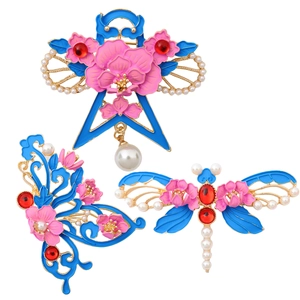 Vintage Chinese style enamel pins set with dragonfly and butterfly motifs in blue and pink