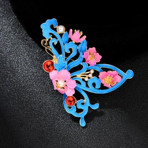 Exquisite blue enamel butterfly brooch with pink floral accents and pearl details