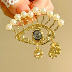 Baroque evil eye brooch with white pearls and gold fringe pendant for suits