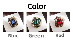 Detailed comparison of luxury vintage brooches with pearl borders in blue, green, and red