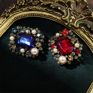 Luxury vintage baroque brooch with pearls and crystals in red and blue gemstones