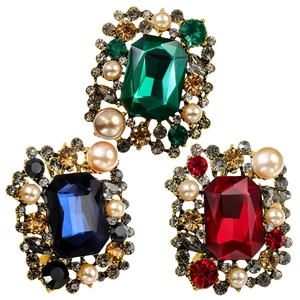 Vintage alloy brooches with emerald, sapphire, and ruby crystals surrounded by pearls