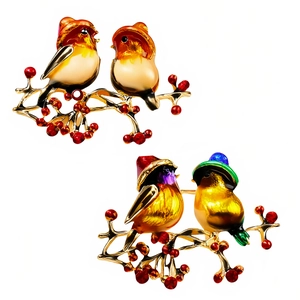 Broches oiseaux chic en émail coloré sur branches dorées avec baies pour l'hiver