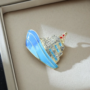 Luxury cruise ship brooch with gold plating and blue enamel in a jewelry gift box
