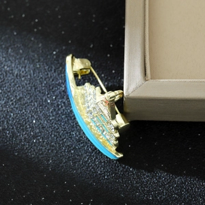Luxury cruise ship brooch with gold plating, blue enamel and sparkling rhinestones