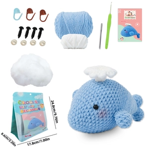 DIY crochet kit for beginners featuring a cute blue whale plush toy and all tools