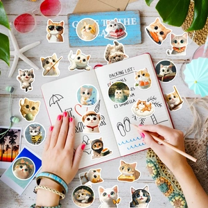 Flat lay of cute cartoon cat stickers on a summer vacation themed stationery setup