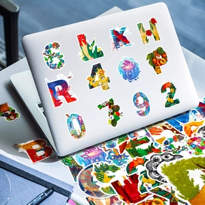 Artistic graffiti alphabet stickers on silver laptop with creative floral patterns