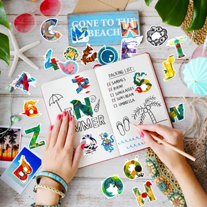 Macro shot of waterproof summer travel graffiti stickers with beach and ocean themed art