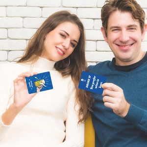 Models holding party drinking game cards with cartoon illustrations and rules