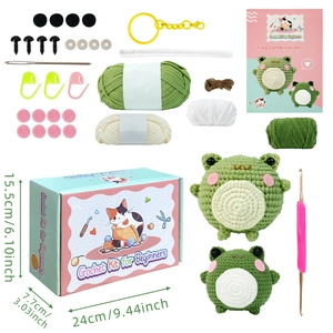 DIY crochet kit for beginners featuring two cute green frogs with full yarn set and tools