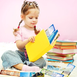 Girl reading with scenic motivational bookmarks featuring inspirational quotes in a cozy room