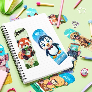 Set of 20 holographic cute animal bookmarks including panda and penguin on a notebook