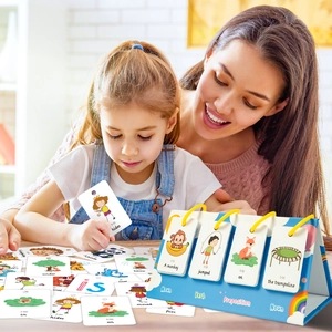 Detailed view of child learning grammar using colorful English word cards with a blue stand