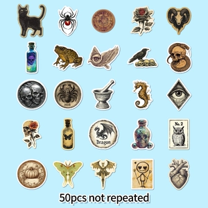Close-up of 25 vintage gothic stickers featuring black cats, skulls, and apothecary themes