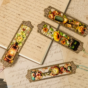 Vintage hollow metal bookmarks with retro themes and colorful silk tassels