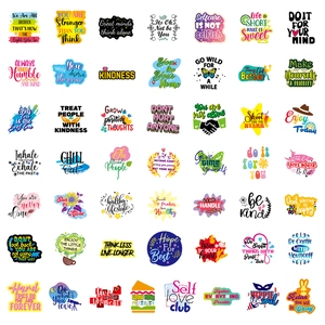 Macro view of motivational stickers with colorful hand-drawn font and graphic elements