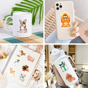 Detail shots of realistic dog stickers applied to a white mug, phone case, and notebook