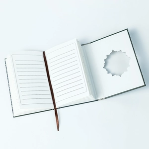 Detail of vintage floral notebook with hollow-out design and ribbon bookmark