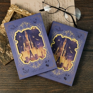Detailed macro shot of Magic Castle notebook with intricate purple dream castle cover art