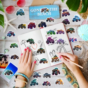 Creative monster truck stickers on a notepad with beach theme props and bright colors