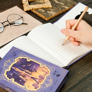 Detail of magic castle themed notebook with 3D paper-cut cover and lined pages