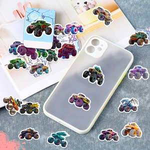 Close-up of monster truck stickers on a phone case and textured surface for decoration