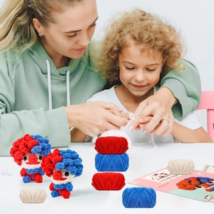 Detail of DIY crochet kit for clown doll including colorful chenille yarn and tools
